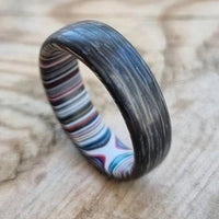 Thumbnail for Fordite rings with carbon fibre and glow powder
