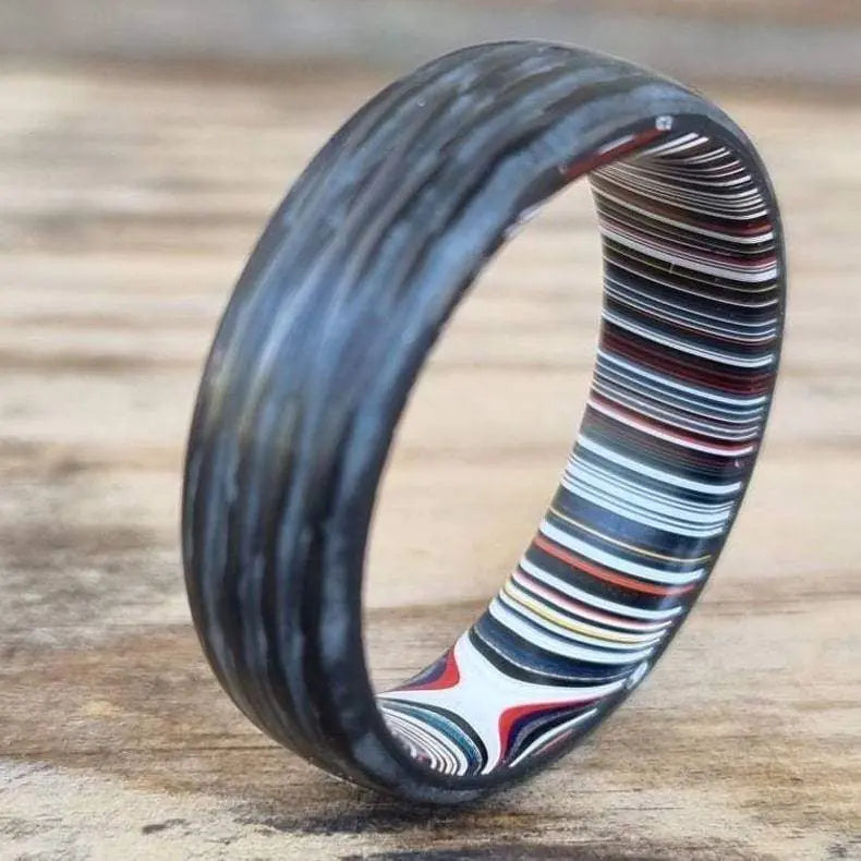 Carbon Fibre Ring with glow powder inlay and inner fordite wedding band