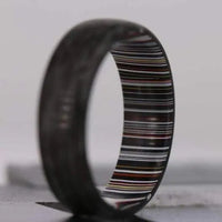 Thumbnail for Mens wedding ring made from fordite and carbon fibre material with glow powder