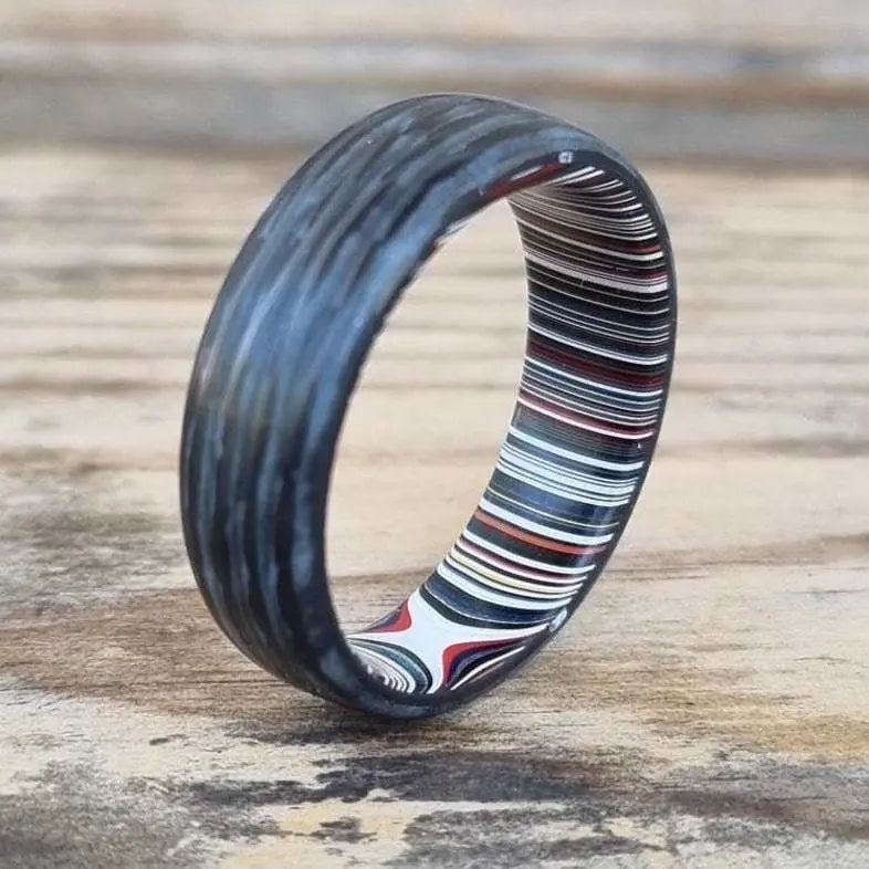 Fordite wedding ring made from glow powder and carbon fibre ideal for wedding and engagement