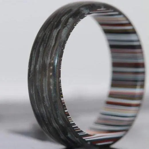 Shop Carbon fibre rings from Orbit rings made from Fordite and Carbon Fibre