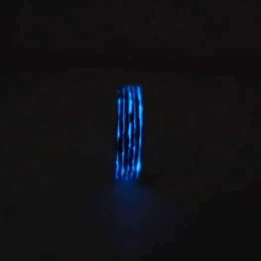 Blue glow in the dark wedding and engagement ring in wood and carbon fibre