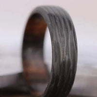 Thumbnail for Zoomed view of mens wedding ring in carbon fibre and wood